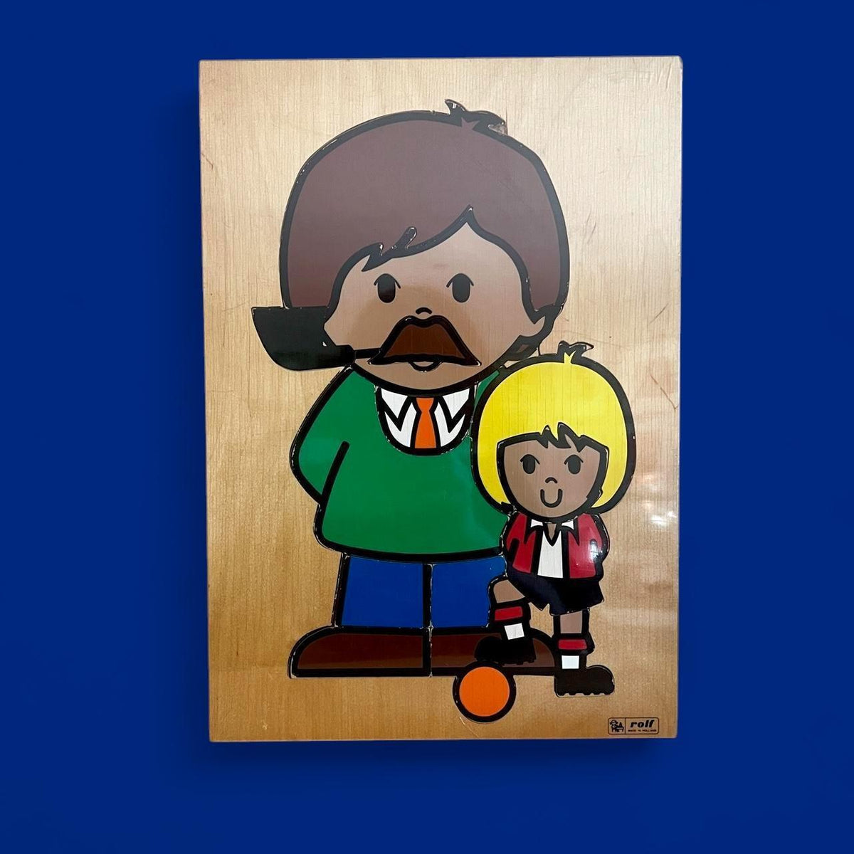 Charming vintage wooden puzzle by Rolf of Holland featuring a footballer and their dad (or coach!).